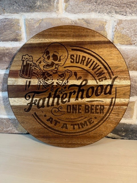 Engraved Acacia Wooden Board/Sign – “Surviving Fatherhood One Beer at a Time”